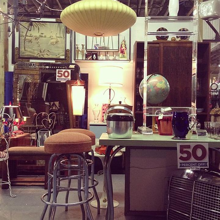 The shop floor crammed with lamps, globes and mid-century treasure