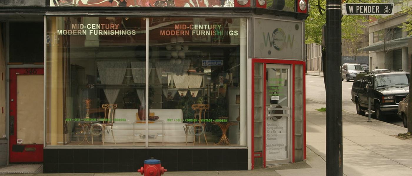 A mid-century-modern furnishings storefront on a sunny street